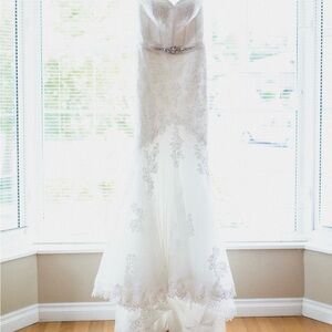 Beautiful mermaid style place and organza wedding gown